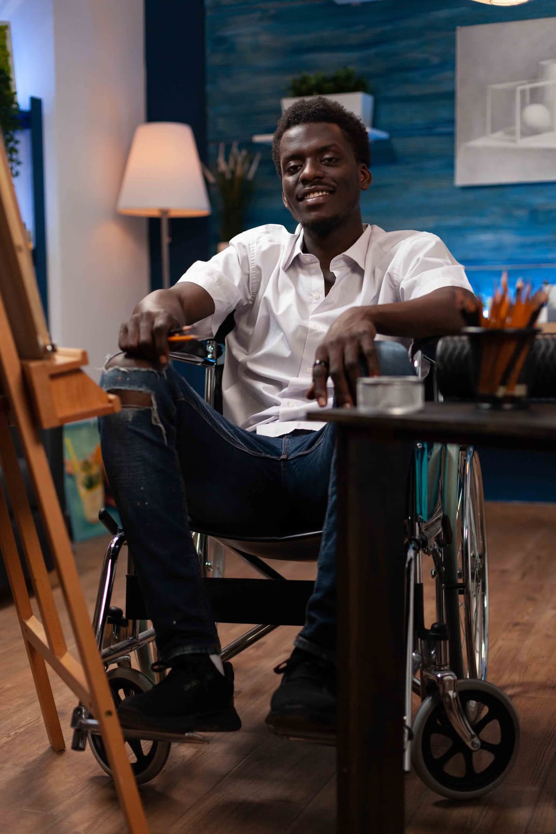 A young man in a wheelchair in recovery after personal injury.